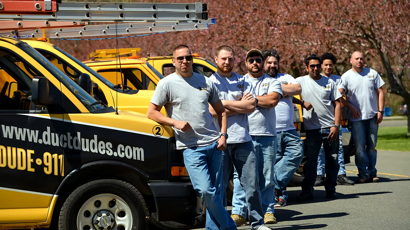 The Duct Dudes crew with their trucks