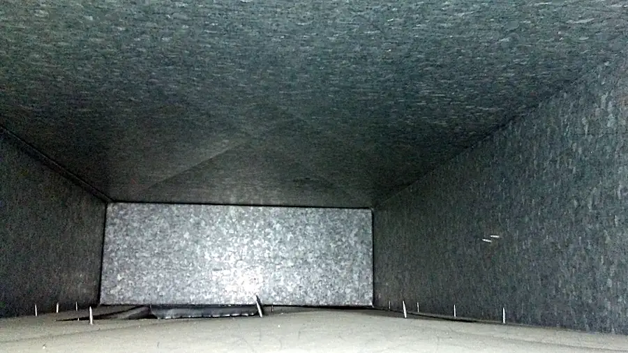 Inside a supply duct after Duct Dudes cleaning: bare, clean galvanized steel